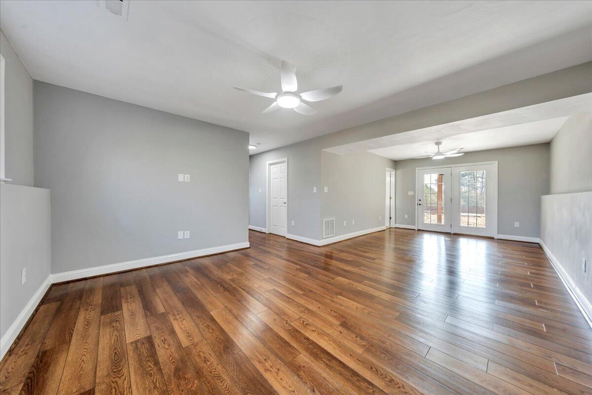 1510 Navigation Point Goodview, VA 24095 - Photo 31 of 48 a view of livingroom with hardwood floor and ceiling fan