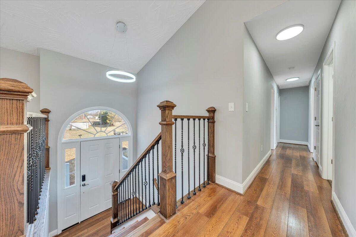 1510 Navigation Point Goodview, VA 24095 - Photo 4 of 48 a view of a livingroom with wooden floor and stairs