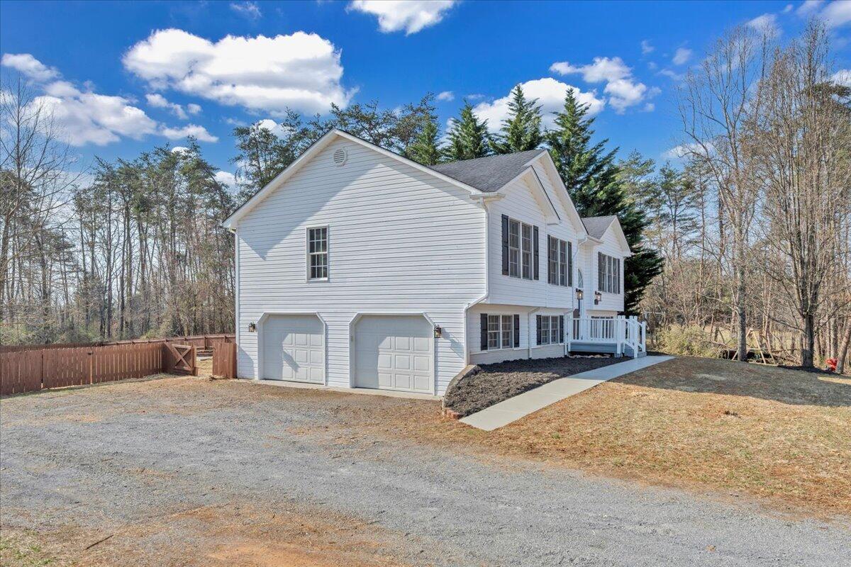 1510 Navigation Point Goodview, VA 24095 - Photo 47 of 48 a front view of a house with a yard and garage