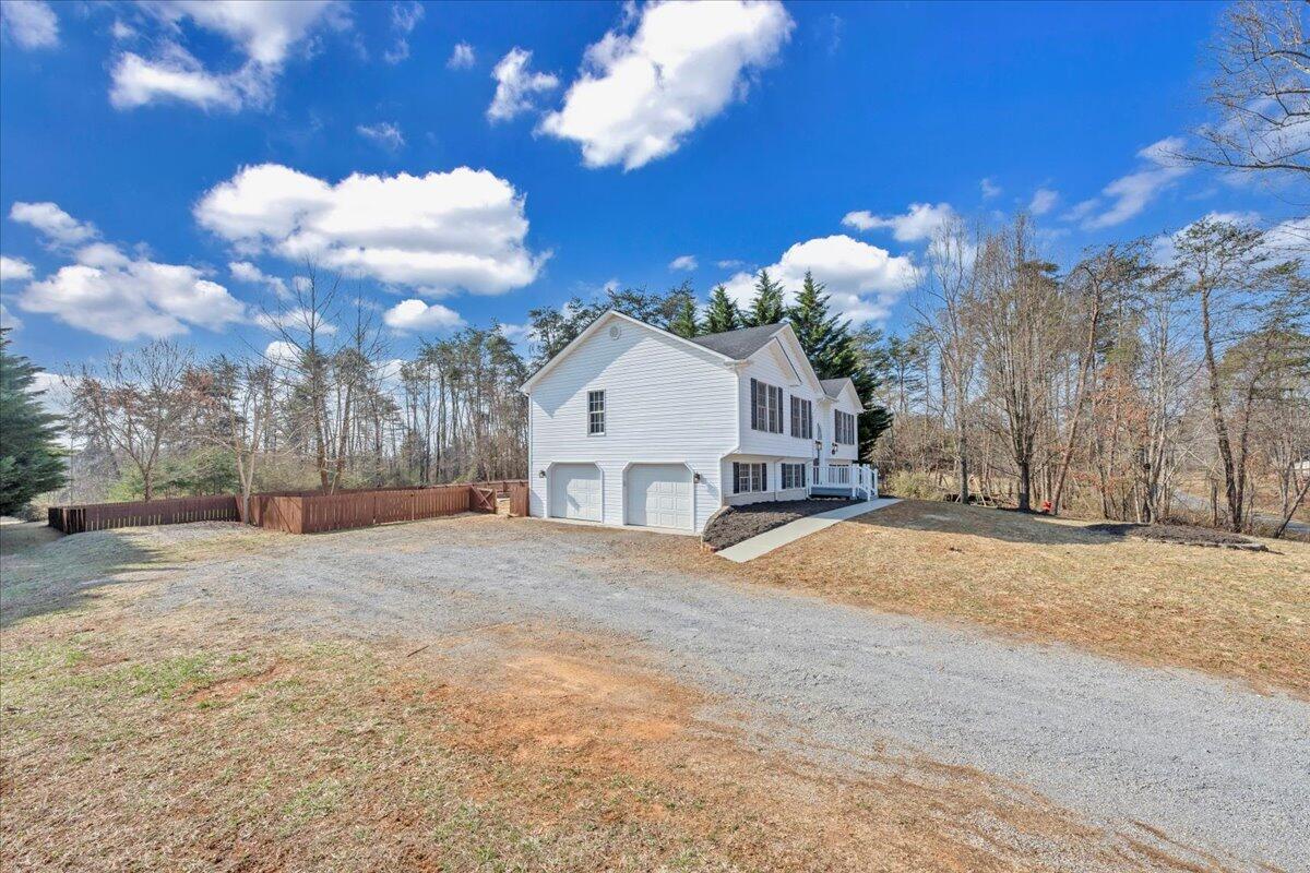 1510 Navigation Point Goodview, VA 24095 - Photo 48 of 48 a view of a white house with a yard