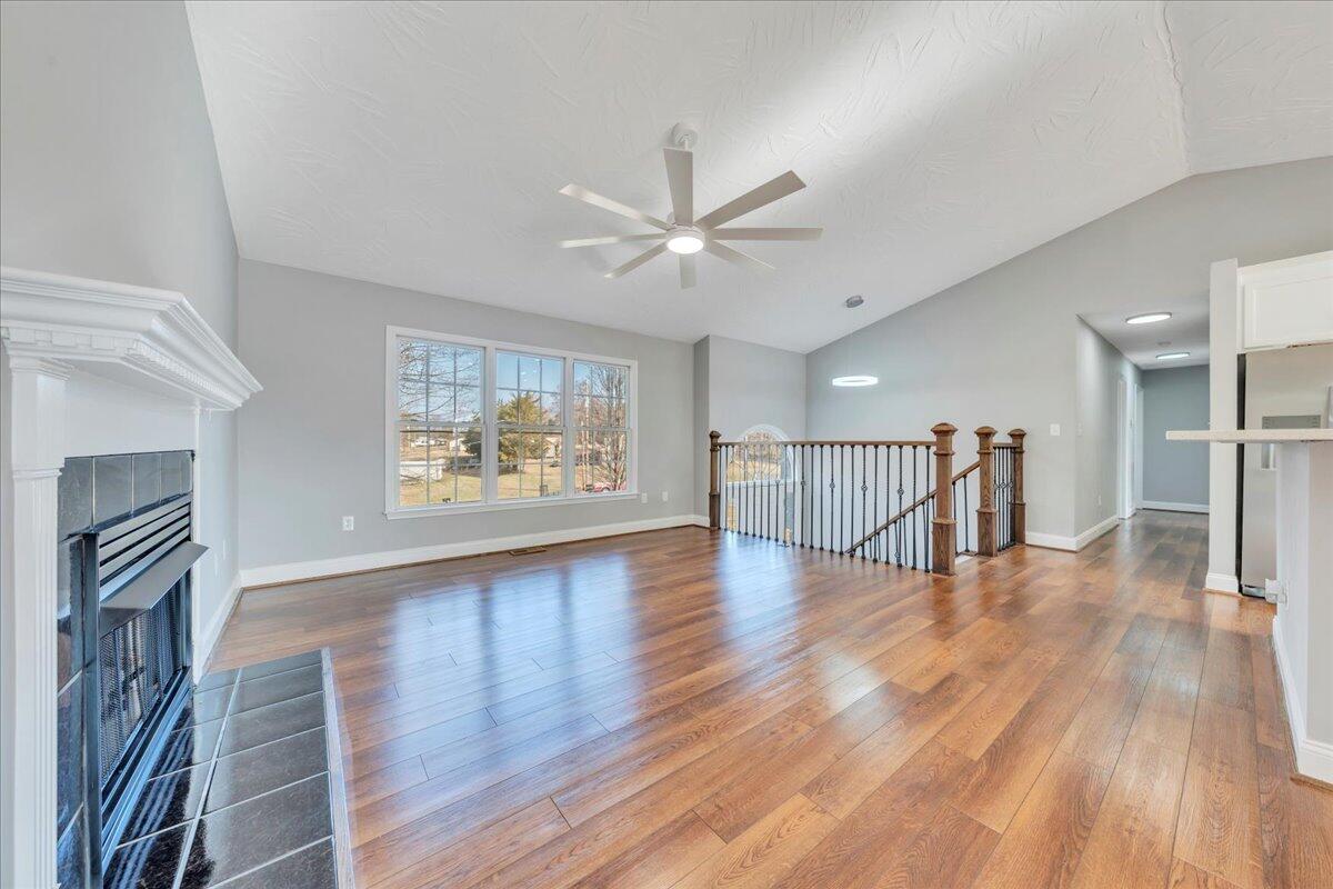 1510 Navigation Point Goodview, VA 24095 - Photo 7 of 48 a view of an empty room with wooden floor and a window
