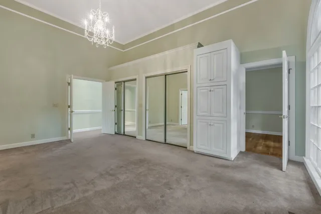 a bath tub sitting in a bathroom next to a window
