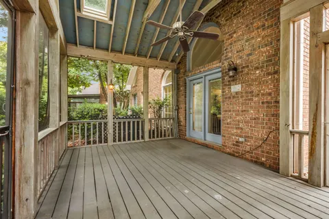 a view of a balcony with wooden floor