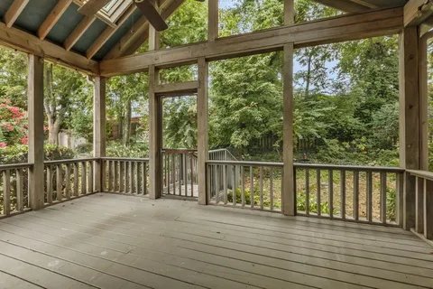 a view of a balcony with wooden floor