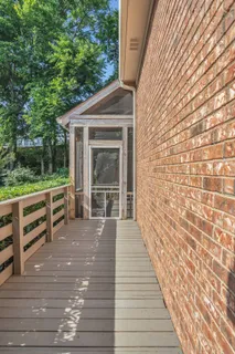 a view of a deck with wooden floor and outer view