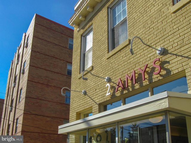 a front view of building with sign board