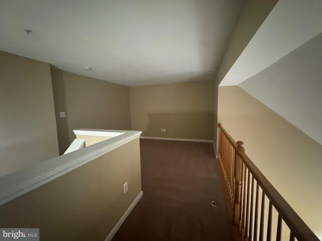 a view of storage and utility room with stairs