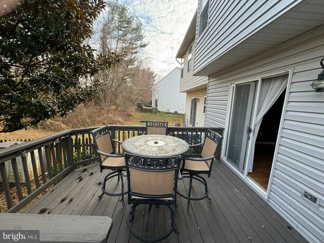 a view of balcony with furniture and wooden deck
