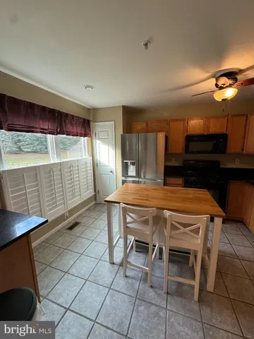 a bed room with a bed and a television