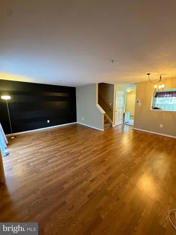 a view of a livingroom with wooden floor