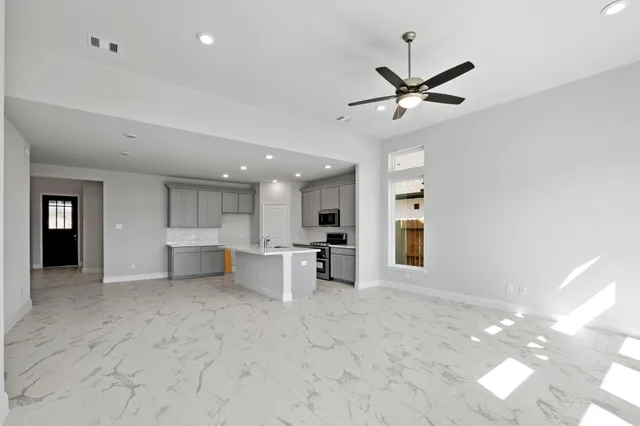 a view of a kitchen with a sink and cabinet