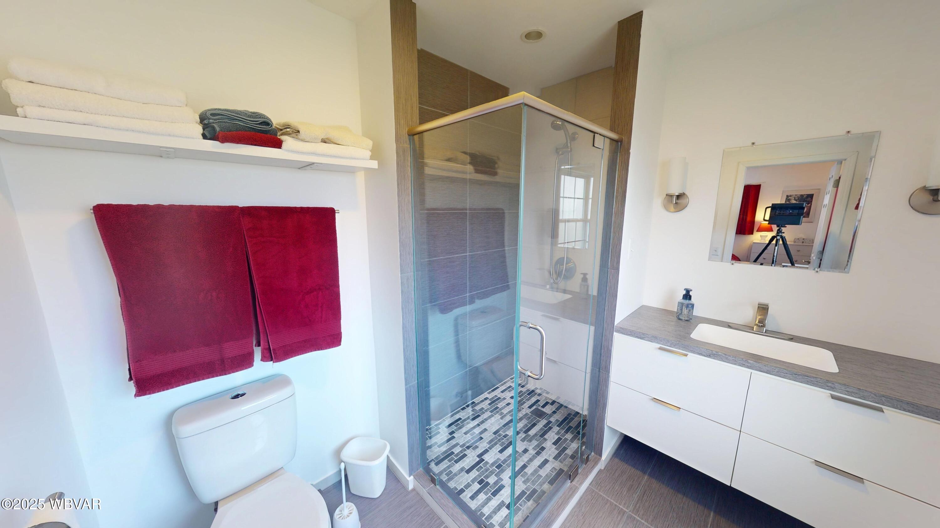 2446 Ritchey Street Williamsport, PA 17701 - Photo 11 of 17 Step into luxury in the beautifully remodeled modern bath, complete with a stylish ceramic-tiled shower and elegant finishes throughout.