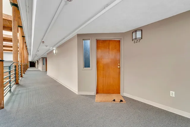 a view of an empty room with stairs