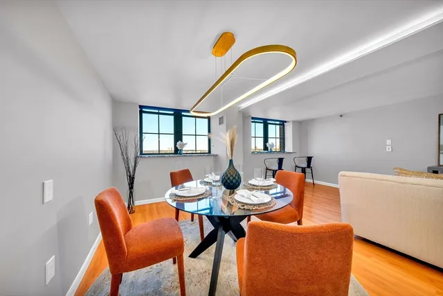 a kitchen with a dining table and chairs