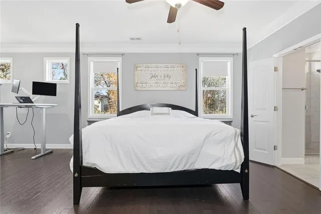 a view of a hallway with windows and stairs
