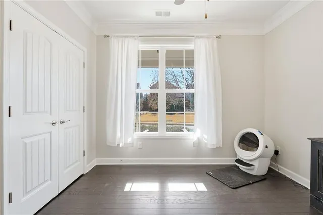 a view of a livingroom with furniture and a window
