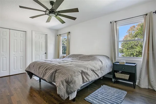 a bedroom with a bed and a window