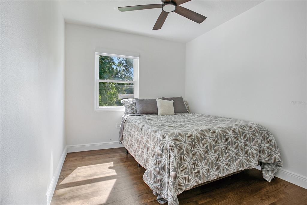 960 Strathmore Drive Orlando, FL 32806 - Photo 14 of 25 a bedroom with a bed and a window