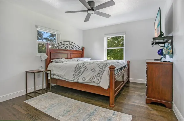 a bedroom with a bed and window