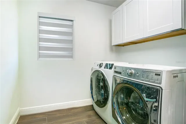a utility room with dryer and washer