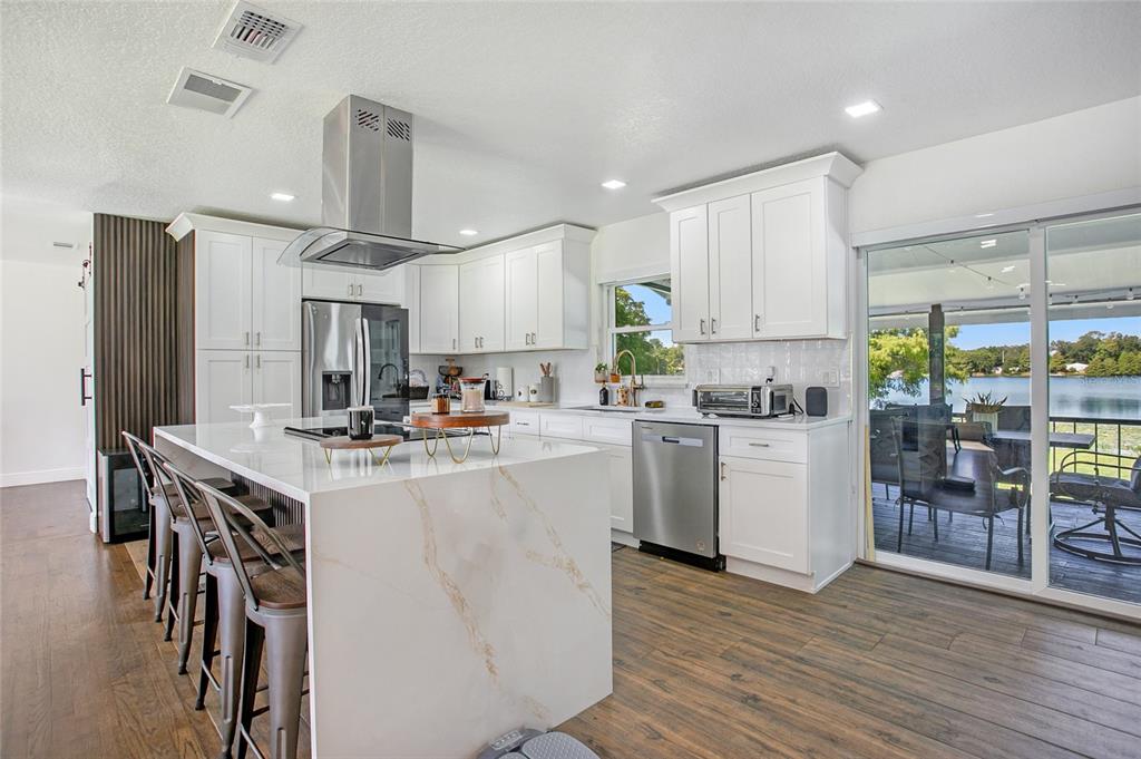 960 Strathmore Drive Orlando, FL 32806 - Photo 5 of 25 a kitchen with appliances a sink and a refrigerator