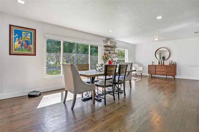 a dining room with furniture window wooden floor