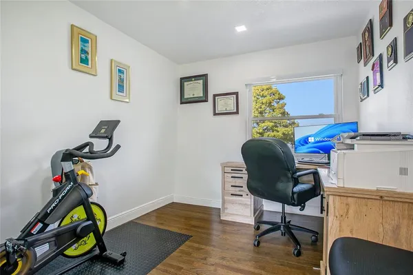 a view of a workspace with furniture and a workspace