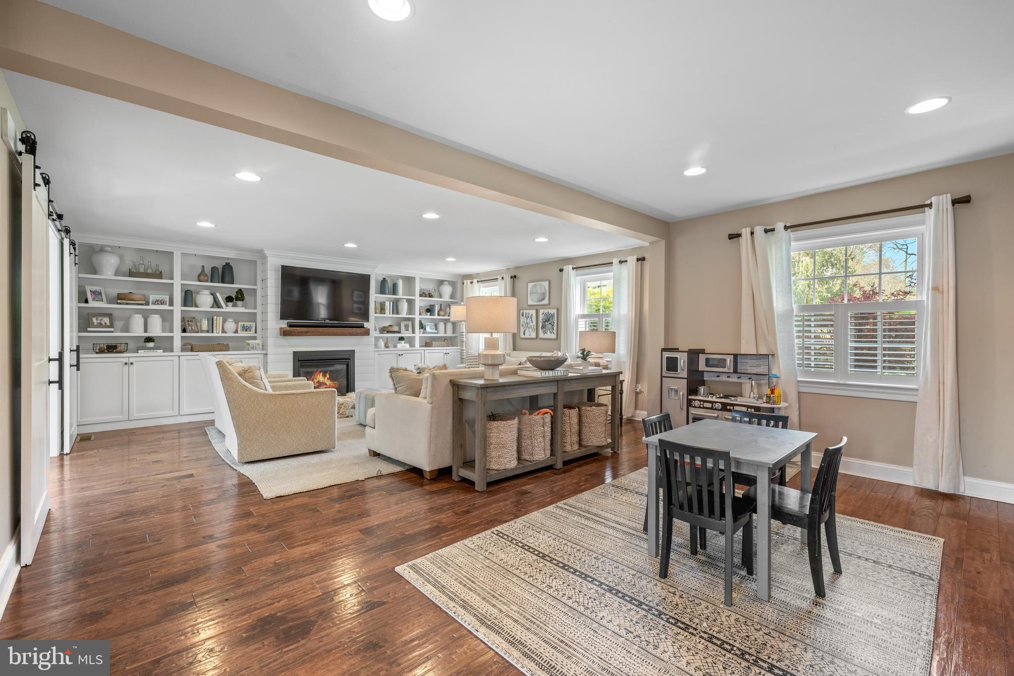 251 Rosedale Avenue Wayne, PA 19087 - Photo 13 of 53 a dining hall with stainless steel appliances kitchen island granite countertop a table chairs and a window