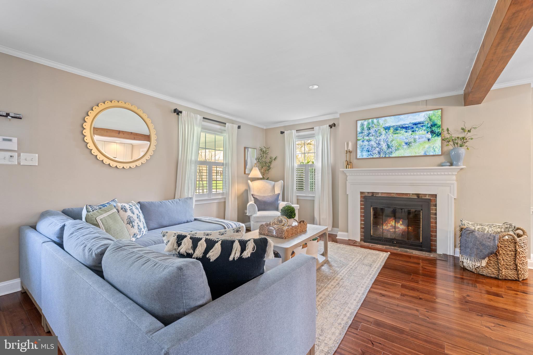 251 Rosedale Avenue Wayne, PA 19087 - Photo 16 of 53 a living room with furniture a fireplace and a large window