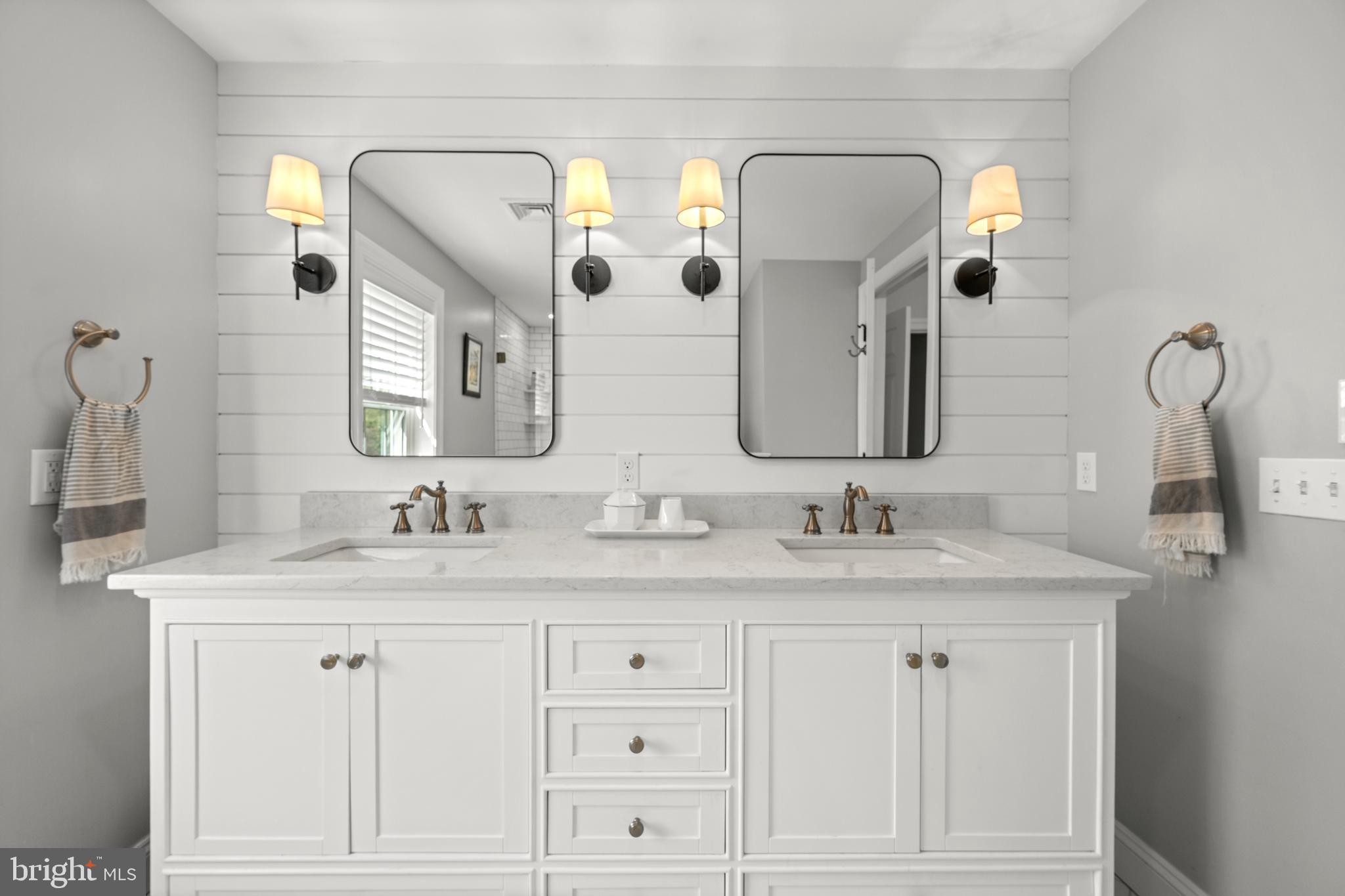 251 Rosedale Avenue Wayne, PA 19087 - Photo 28 of 53 a bathroom with a double vanity sink and mirror