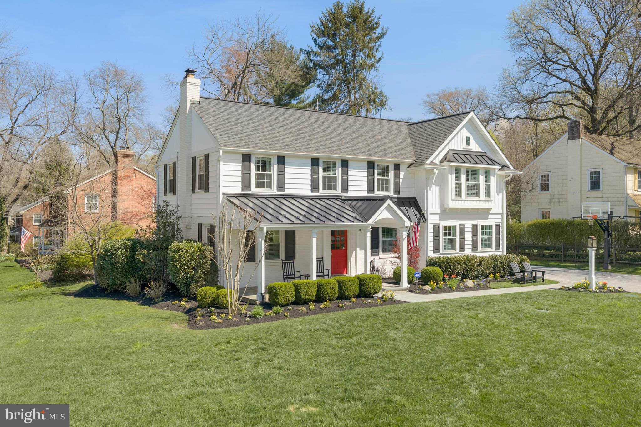 251 Rosedale Avenue Wayne, PA 19087 - Photo 3 of 53 a front view of a house with a garden