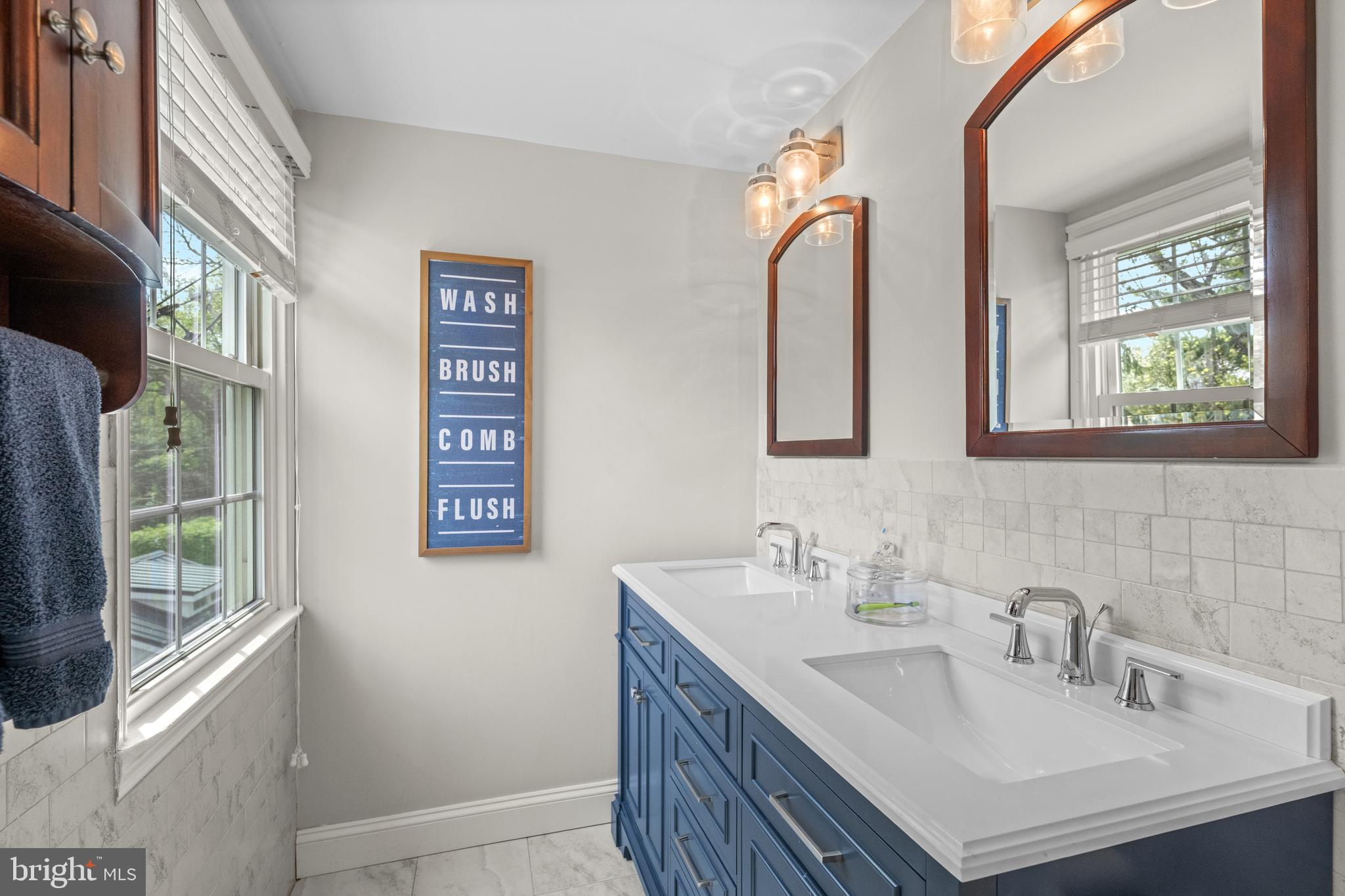251 Rosedale Avenue Wayne, PA 19087 - Photo 37 of 53 a bathroom with a sink and a mirror