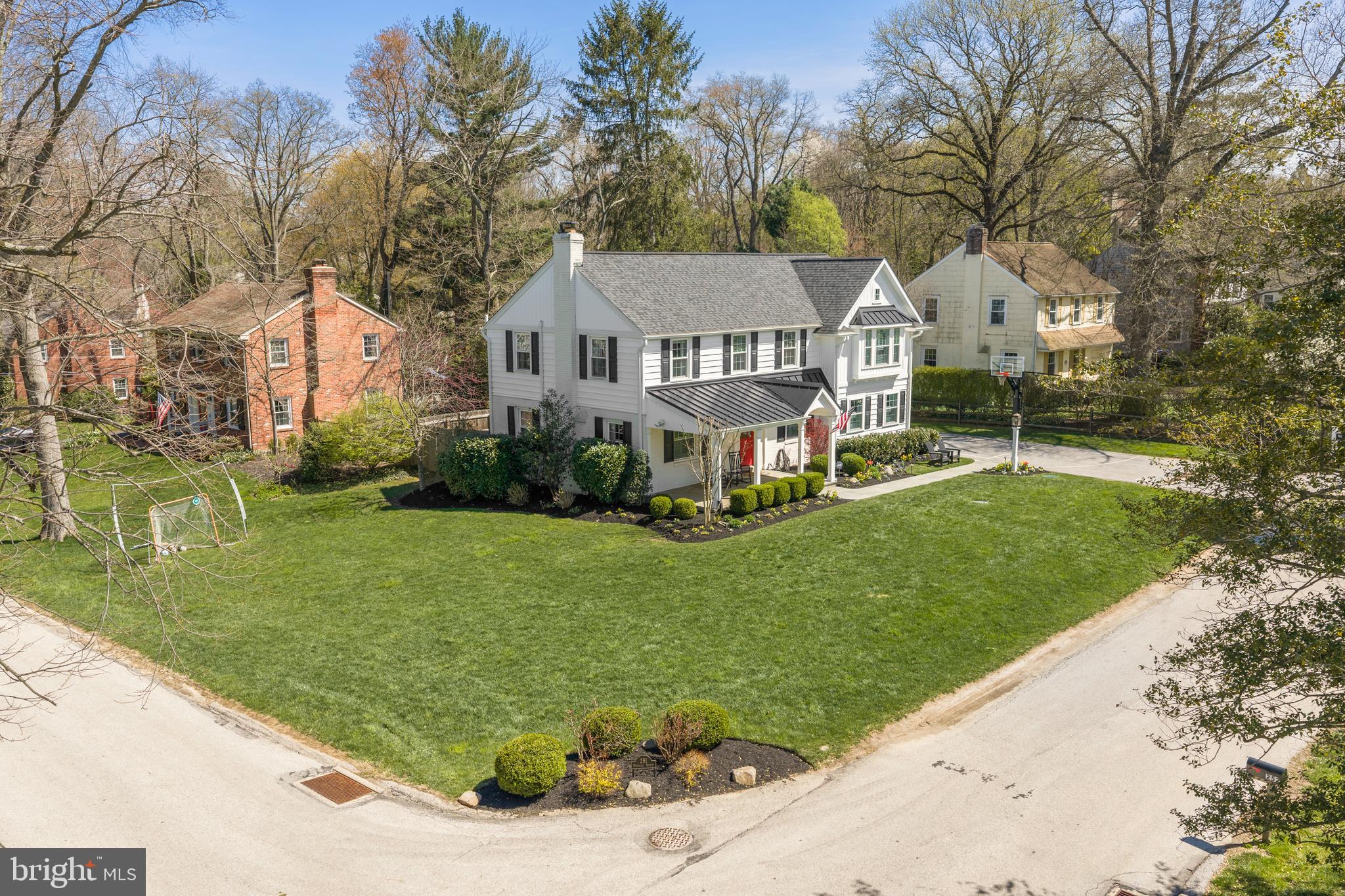 251 Rosedale Avenue Wayne, PA 19087 - Photo 5 of 53 a front view of a house with a garden and trees