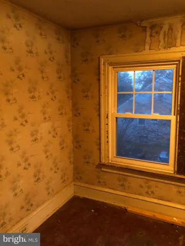 a view of front door with wooden floor