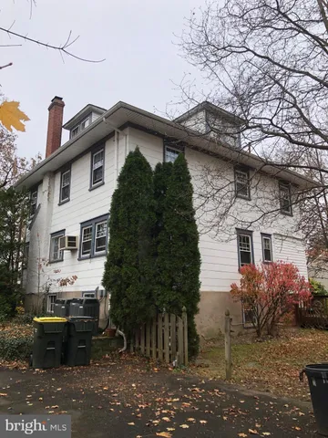 a kitchen with stainless steel appliances kitchen island granite countertop a refrigerator and a stove top oven