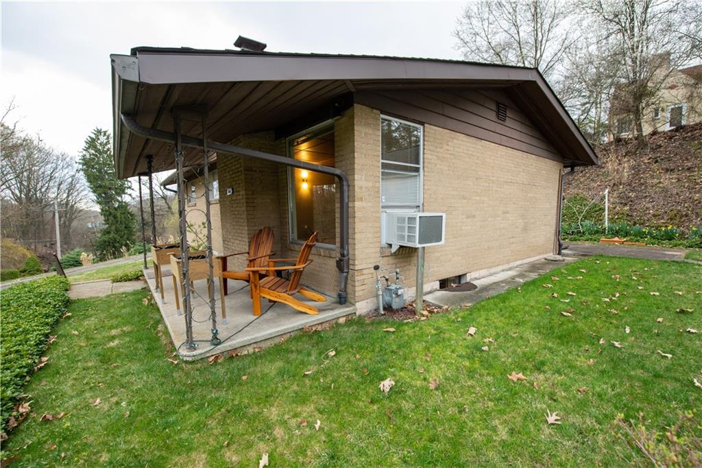 1041 Anderson Road Pittsburgh, PA 15209 - Photo 39 of 41 a view of backyard with a slide and a table and chairs