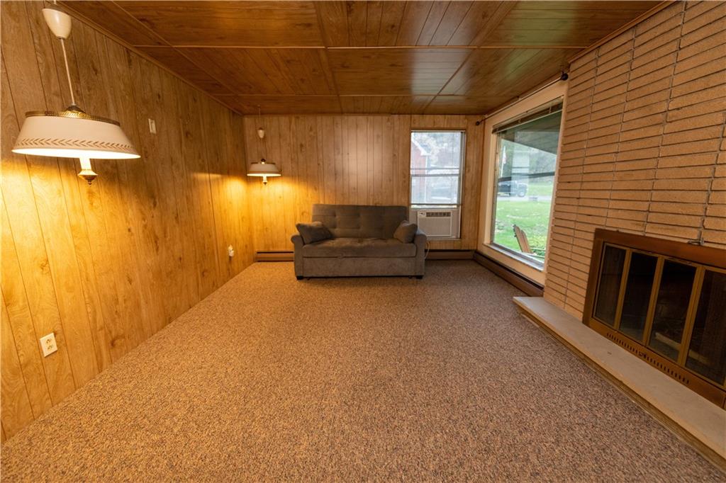 1041 Anderson Road Pittsburgh, PA 15209 - Photo 6 of 41 a living room with furniture and a chandelier