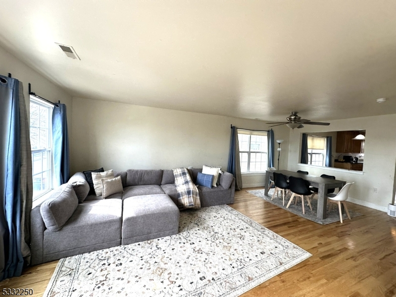 a living room with furniture rug and window