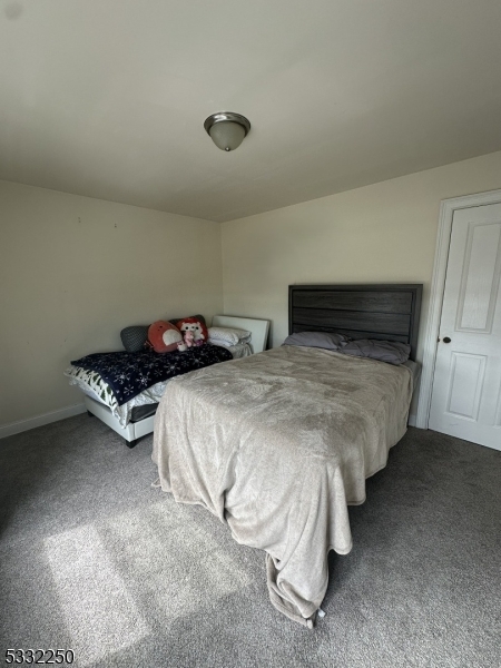 178 Front Street Elizabeth Port, NJ 07206 - Photo 11 of 19 a bedroom with a bed and a table