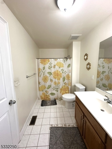 178 Front Street Elizabeth Port, NJ 07206 - Photo 13 of 19 a bathroom with a sink a toilet and shower
