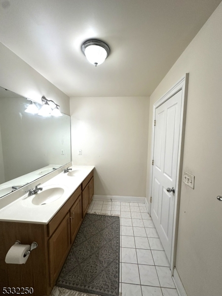178 Front Street Elizabeth Port, NJ 07206 - Photo 14 of 19 a bathroom with a sink a mirror and a shower