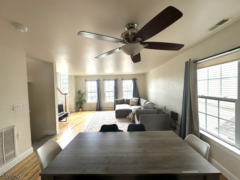 178 Front Street Elizabeth Port, NJ 07206 - Photo 3 of 19 a view of a dining room with furniture window and wooden floor