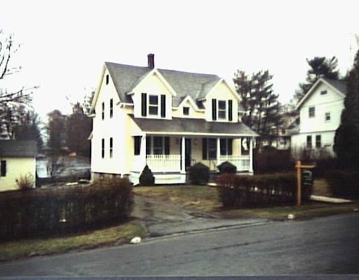10 Greenfield Avenue Ridgefield, CT 06877 - Photo 1 of 1 a front view of a house with a yard