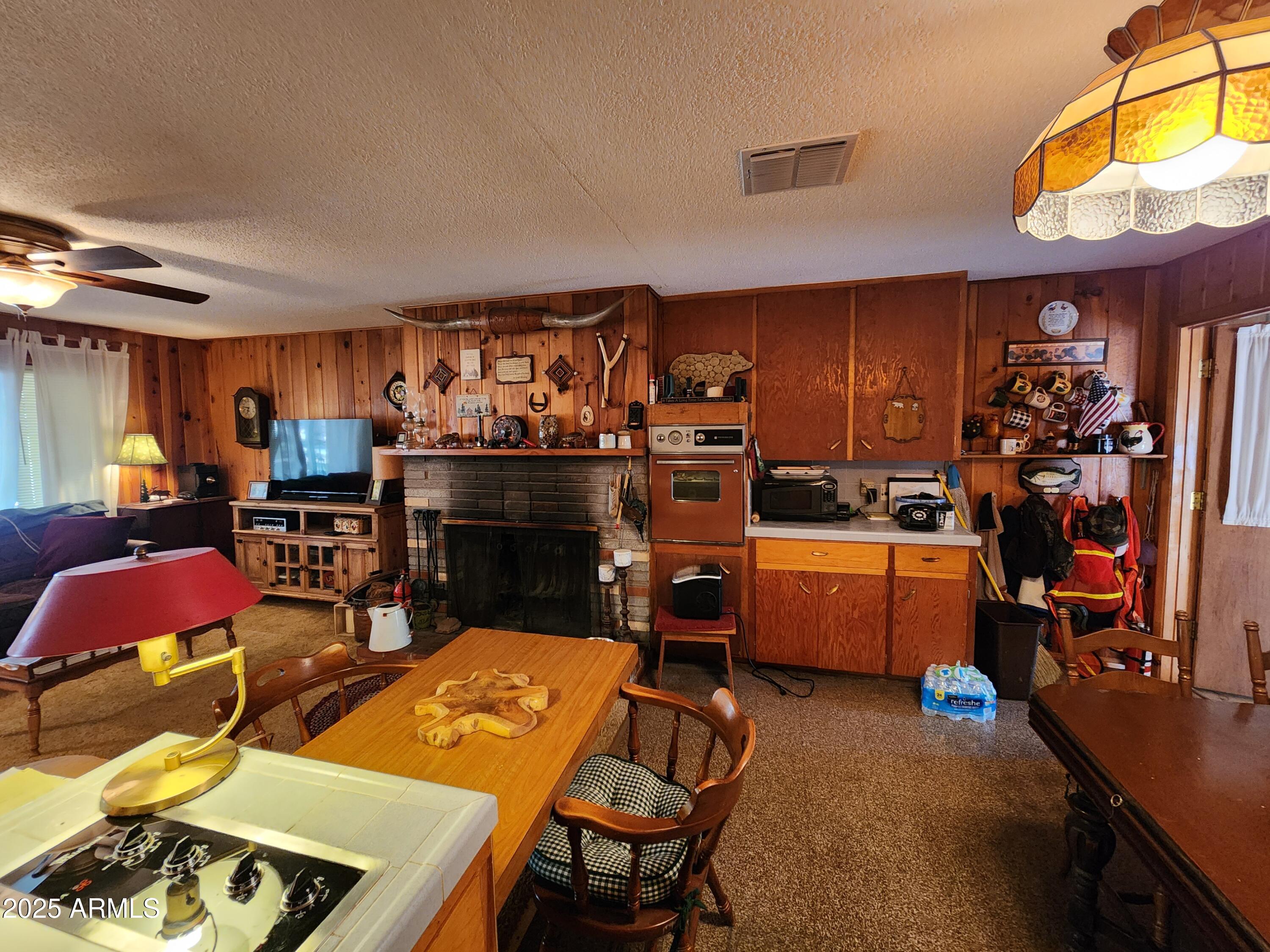 247 West Diamond Road Payson, AZ 85541 - Photo 11 of 42 a kitchen with stainless steel appliances kitchen island granite countertop a sink and cabinets