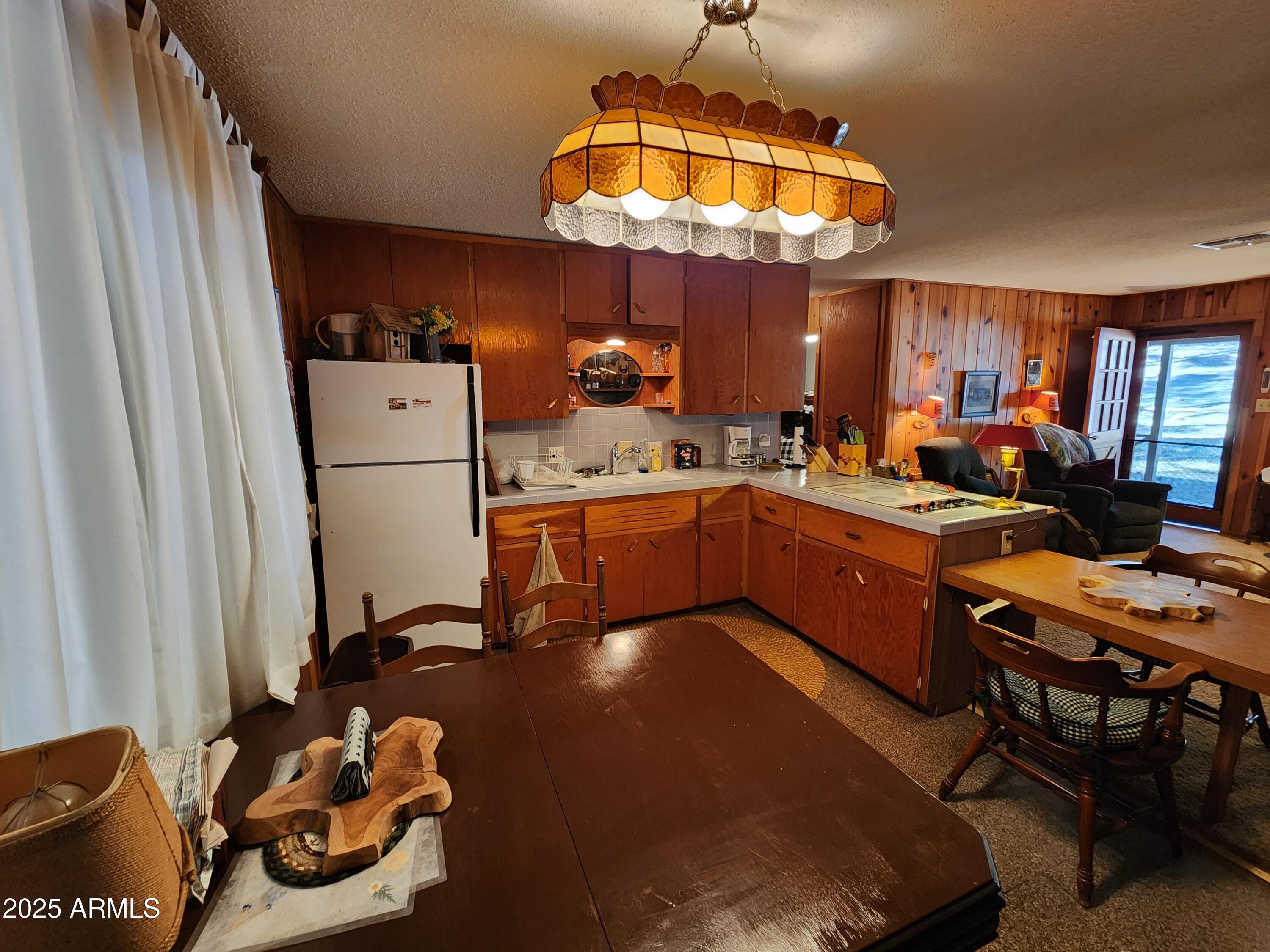 247 West Diamond Road Payson, AZ 85541 - Photo 12 of 42 a room with gym equipment and a chandelier