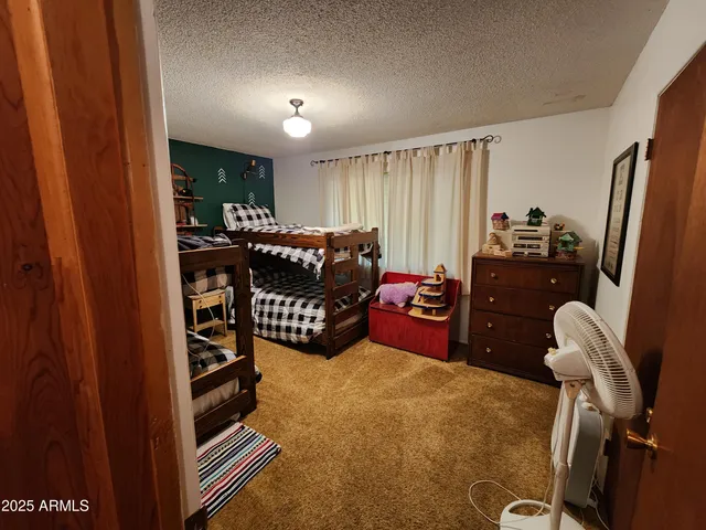 a bed room with furniture and a window