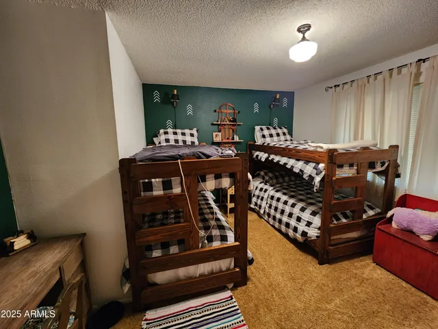 a bedroom with furniture and window