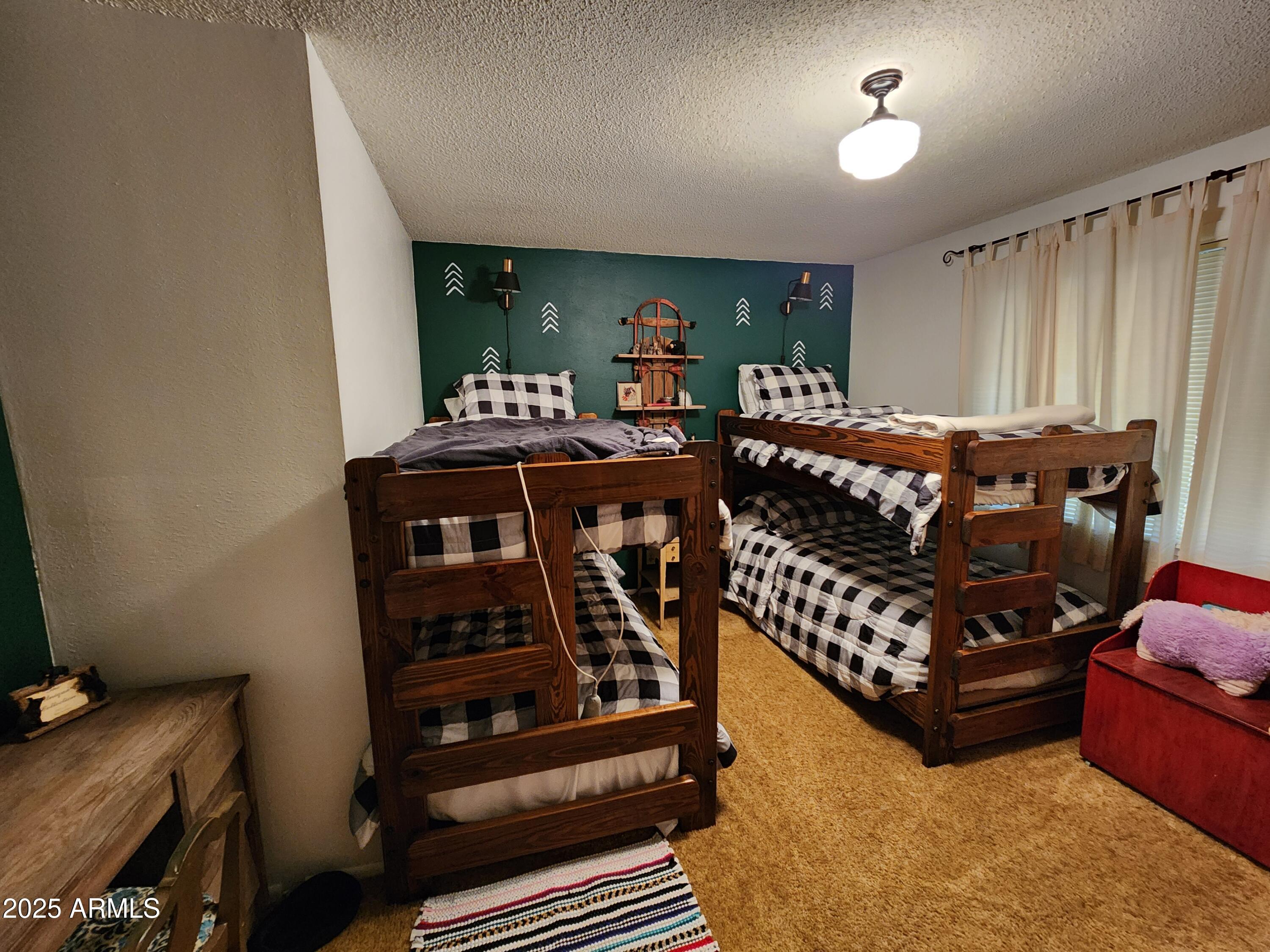 247 West Diamond Road Payson, AZ 85541 - Photo 16 of 42 a bed room with furniture and a window