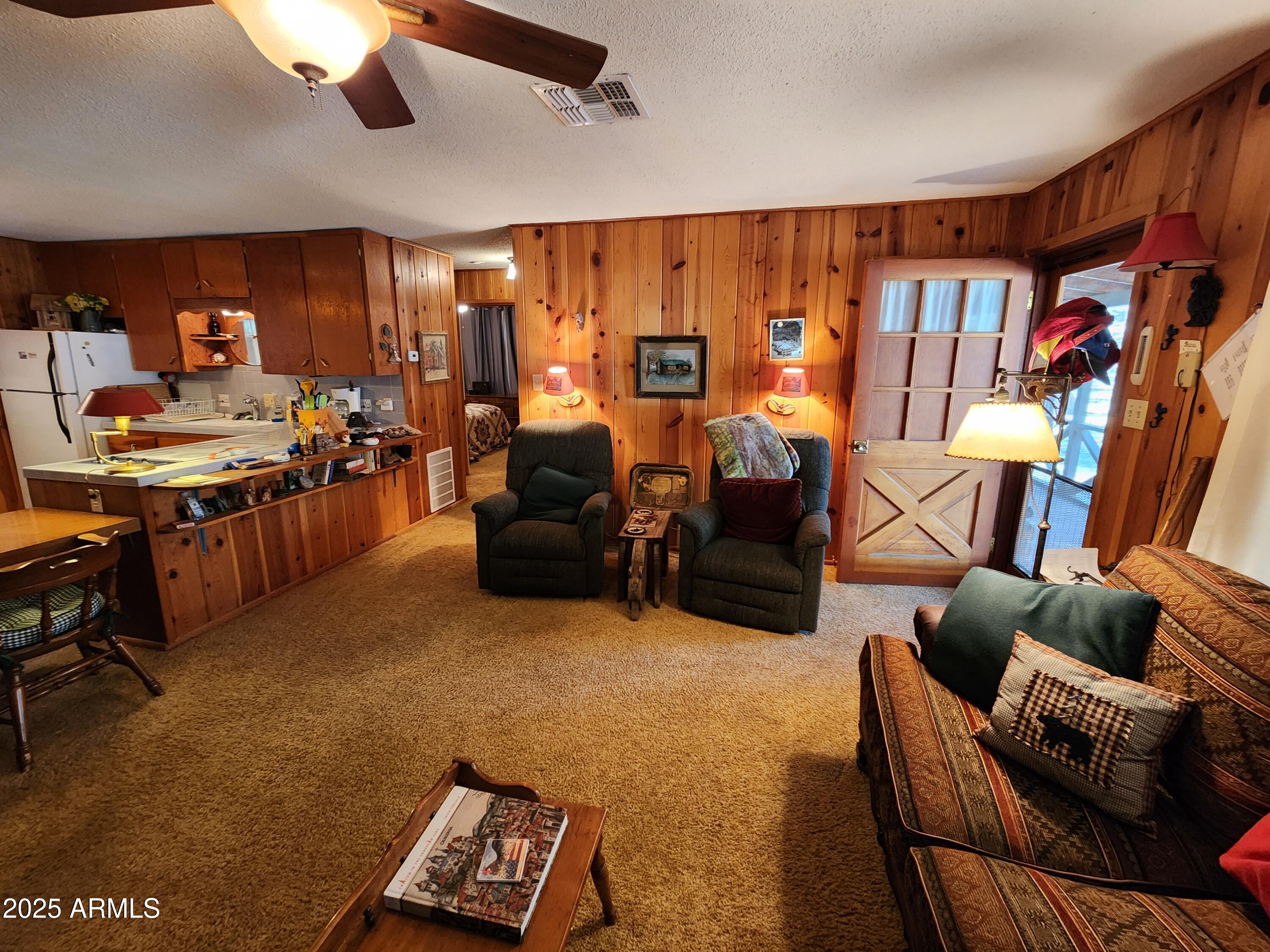 247 West Diamond Road Payson, AZ 85541 - Photo 7 of 42 a living room with furniture a rug and a chandelier