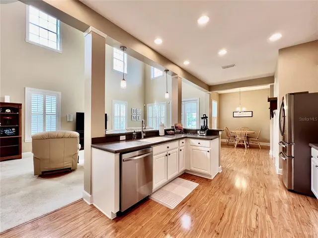 a kitchen with stainless steel appliances granite countertop a stove and a refrigerator